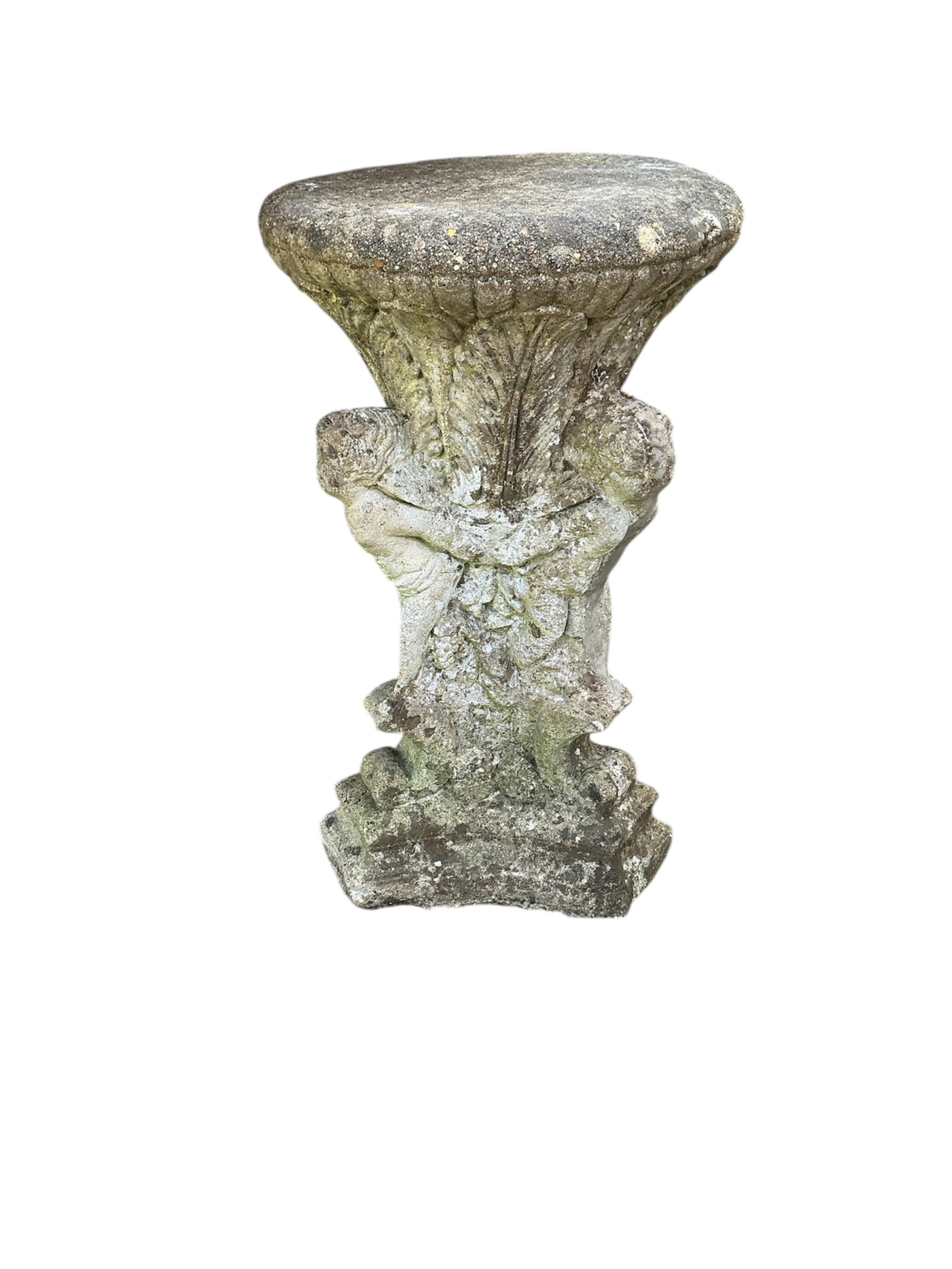 A reconstituted stone circular garden pedestal, height 53cm together with six assorted garden ornaments